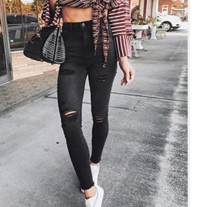 Black high-waisted distressed jeans